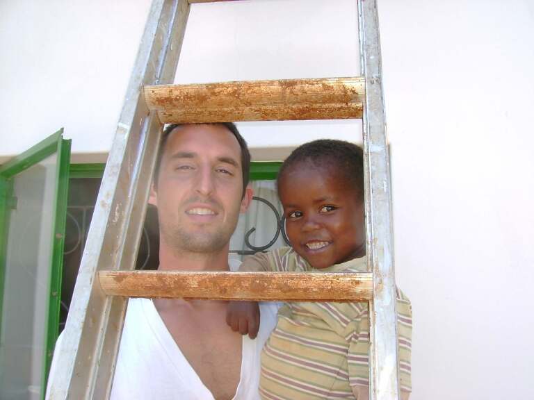 Kirk and Child seen through a ladder