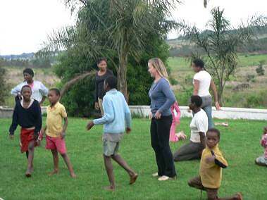 Volunteer playing wiht the children